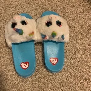 Blue unicorn flip-flops